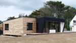 Maison sur pieux vissés-Ossature en douglas-Bardage a claire-voie